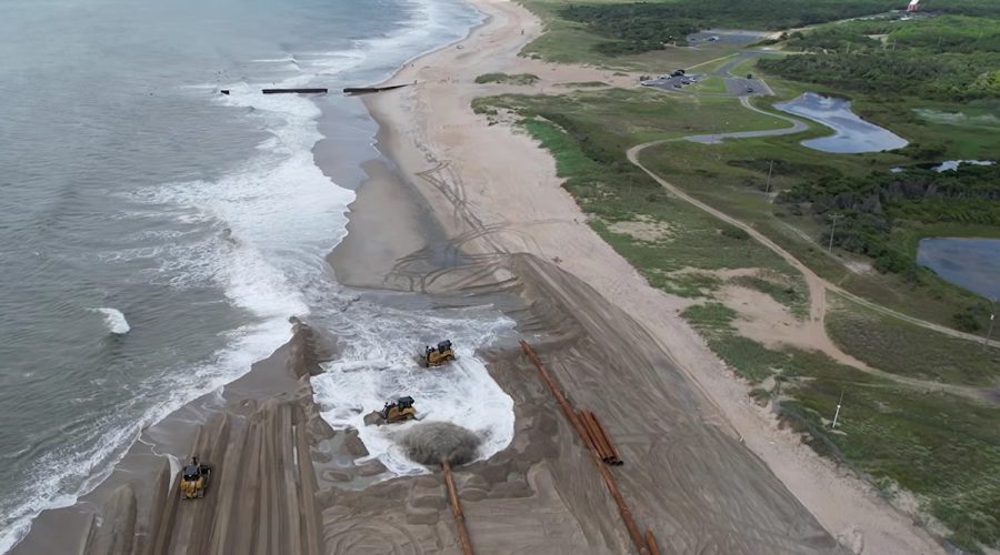 The beach nourishment project at Hatteras Island, just north of the groin near the lighthouse's former, original location, is shown in this screen grab from a March 10 Dare County video update.