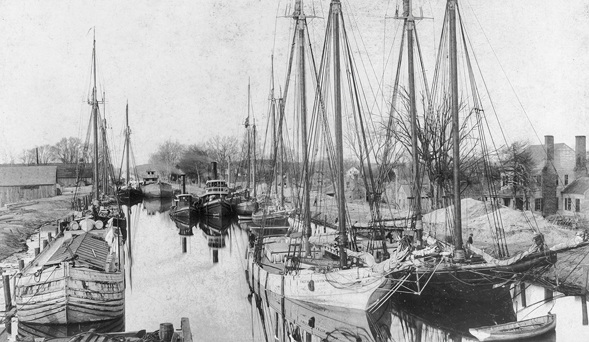 Vessels are moored in the Dismal Swamp Canal at South Mills in this circa 1900 photo from the North Carolina Collection, University of North Carolina at Chapel Hill Library.