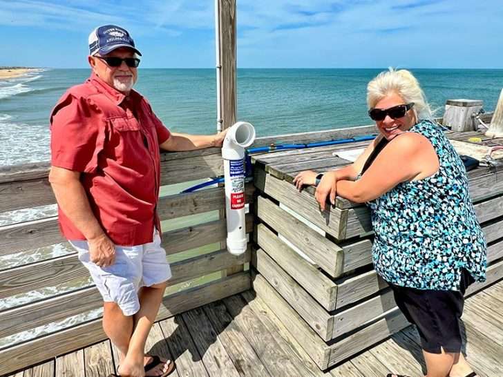 David Masters Jr., vice president of the Outer Banks Anglers Club, and Debbie Swick, a local environmental advocate and club member, are leading the club’s effort to recover and recycle monofilament fishing line. Here, they pose with a newly installed vessel at Avalon Pier.
Photo: Brian Tress