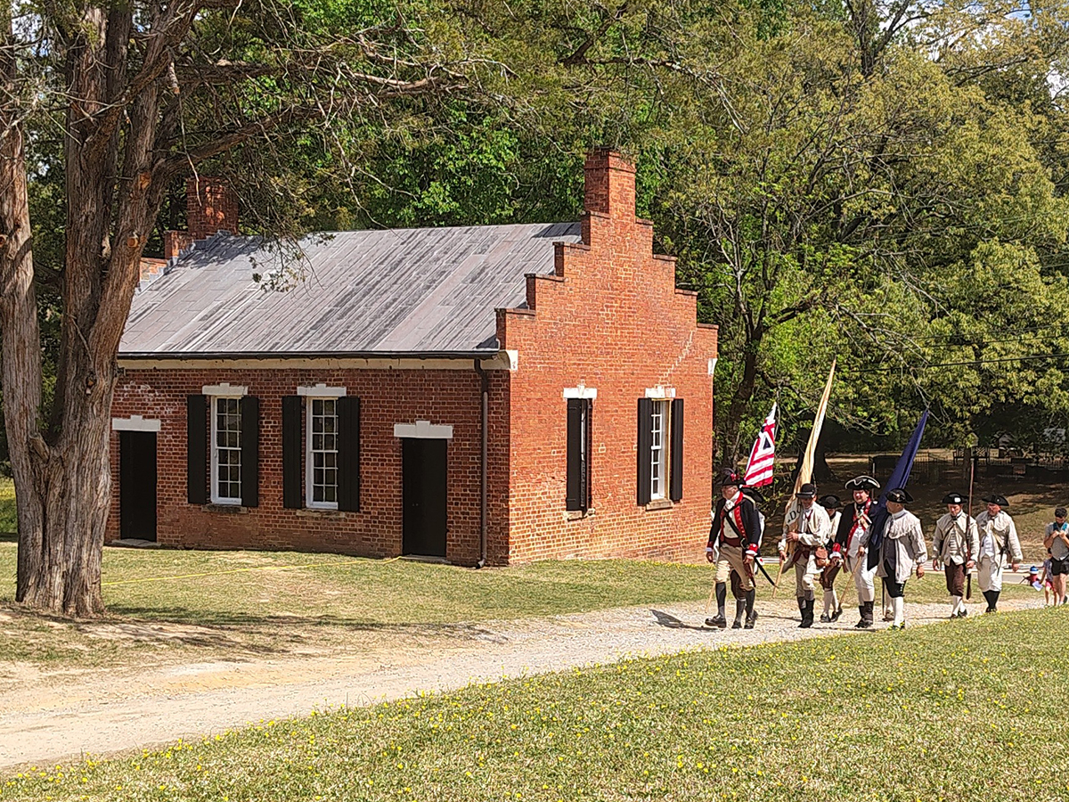 Reenactors traverse the grounds of Historic Halifax State Historic Site Sunday during the 250th anniversary commemoration of the Halifax Resolves. Photo: Jennifer Allen