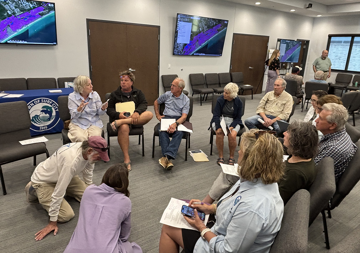 Surf City resident Sabrina Guy speaks with fellow residents, business owners and town staff April 14 during a public forum on shellfish leasing in the waters at Topsail Island. Photo: Trista Talton