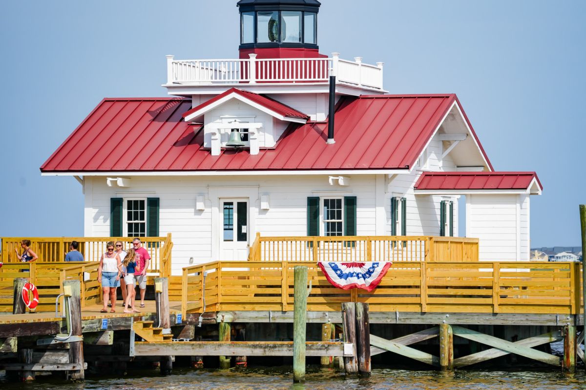 Roanoke Marshes Lighthouse stretches is perched on a deck extending 40 yards into Shallowbag Bay in Manteo. Photo: Manteo