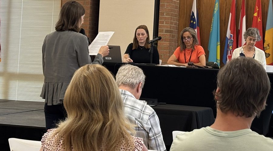Southern Environmental Law Center attorney Kasey Moraveck speaks at the podium Tuesday in Fayetteville during a public hearing on proposed monitoring and minimization rules for industrial dischargers of 1,4-dioxane and the public sewage plants that accept their wastewater. Photo: Trista Talton