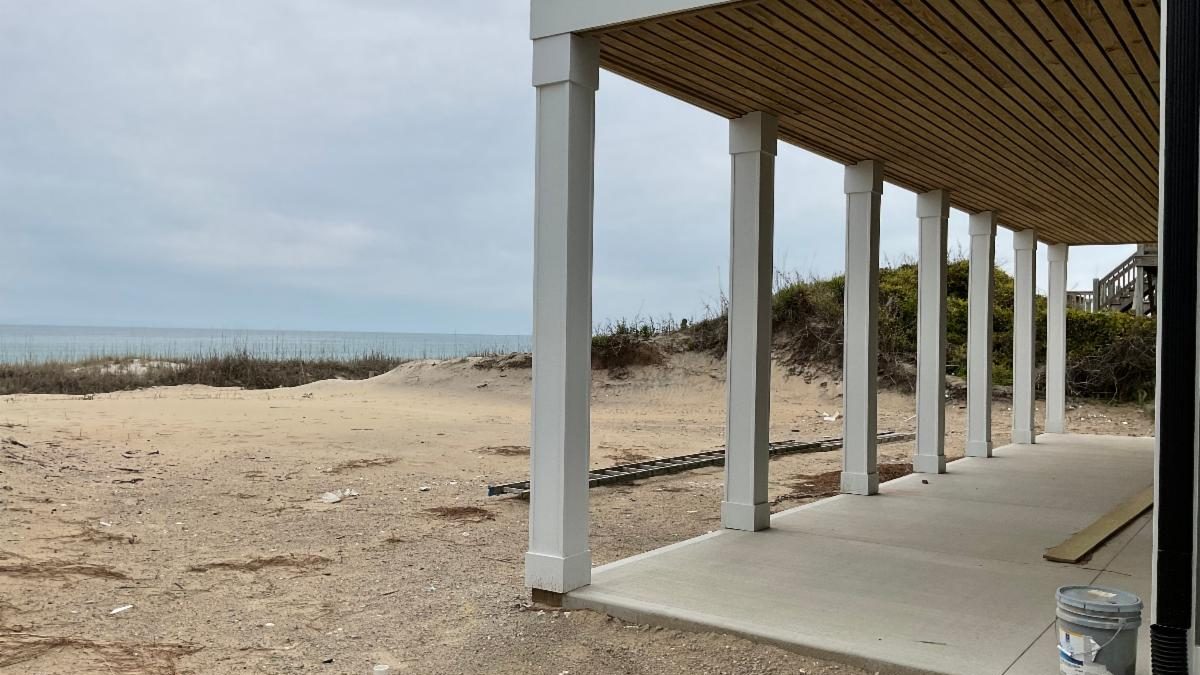 The flattening of the frontal dune at this house in Emerald Isle has town officials weighing dramatically increased fines for violations of its dune and vegetation ordinance, which is currently a $1,000 penalty. Photo: Town of Emerald Isle