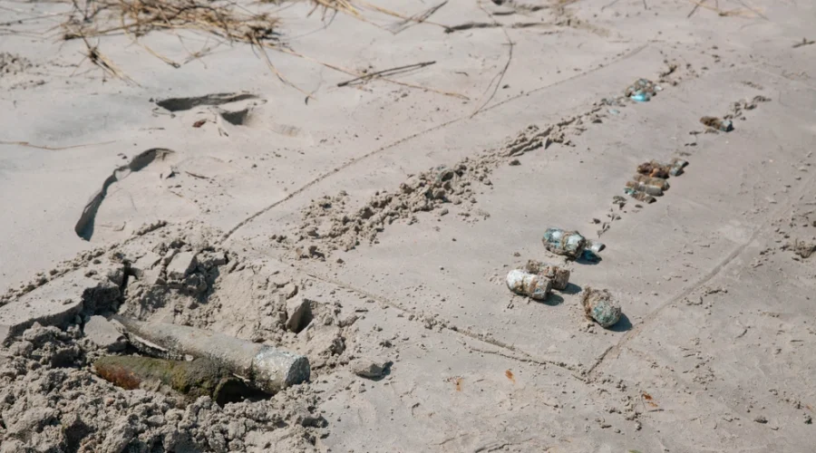 Unexploded ordnance is marked May 14 on the shore of Browns Island, part of Marine Corps Base Camp Lejeune. Photo: U.S. Marine Corps, Cpl. Daniela Chicas Torres