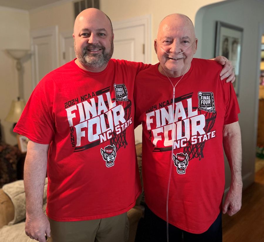 Dr. Jared Bowden, North Carolina State Climate Office director, and his father, Don Bowden, who died in November at 78, don matching Wolfpack red Final Four T-shirts. 