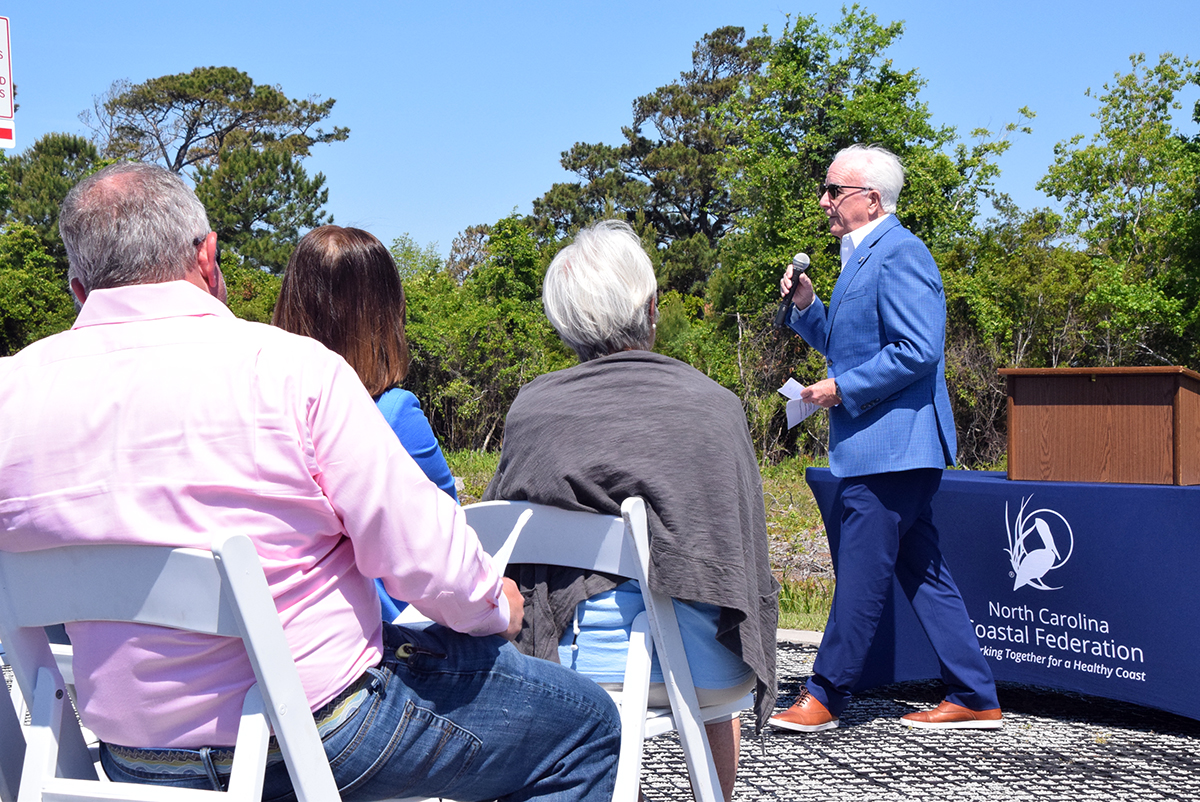Tom Looney, a North Carolina Coastal Federation director, speaks Monday to those gathered for the groundbreaking ceremony at the site of the planned Shellfish Mariculture Hub in Carteret County. Photo: Mark Hibbs