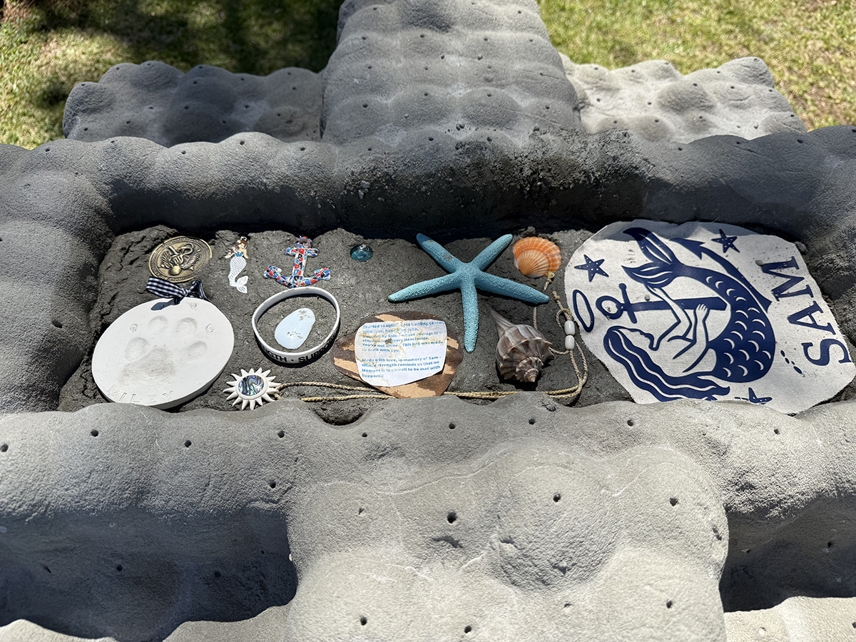 A veteran's personal effects are placed Friday in a memorial eco-positive reef module. Photo: Vivian Yuditsky