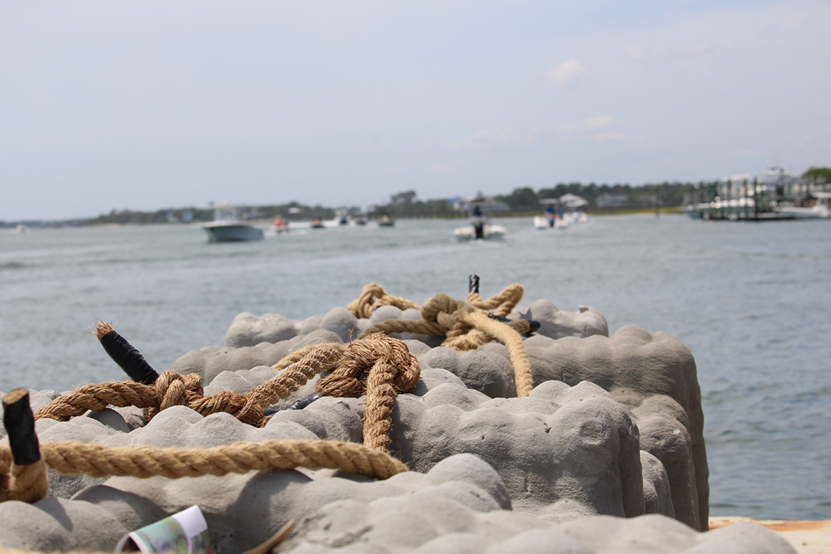 Veterans Memorial Reef markers are staged Sunday on a barge alongside Dockside Restaurant in Wrightsville Beach in preparation for Monday's launch out to AI-372, the Veterans Memorial reef site. Photo: Vivian Yuditsky