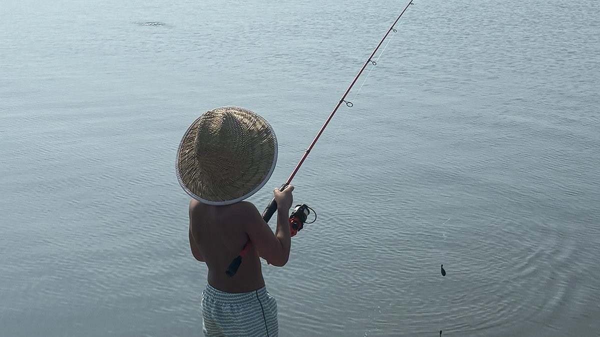 Case Skinner, 4, son of Kathleen and Jeremy Skinner, fishes from his parents' dock on on the Newport River in Mill Creek, an unincorporated community in central Carteret County. The young Skinner is also accomplished with a cast net. Photo: Jeremy Skinner