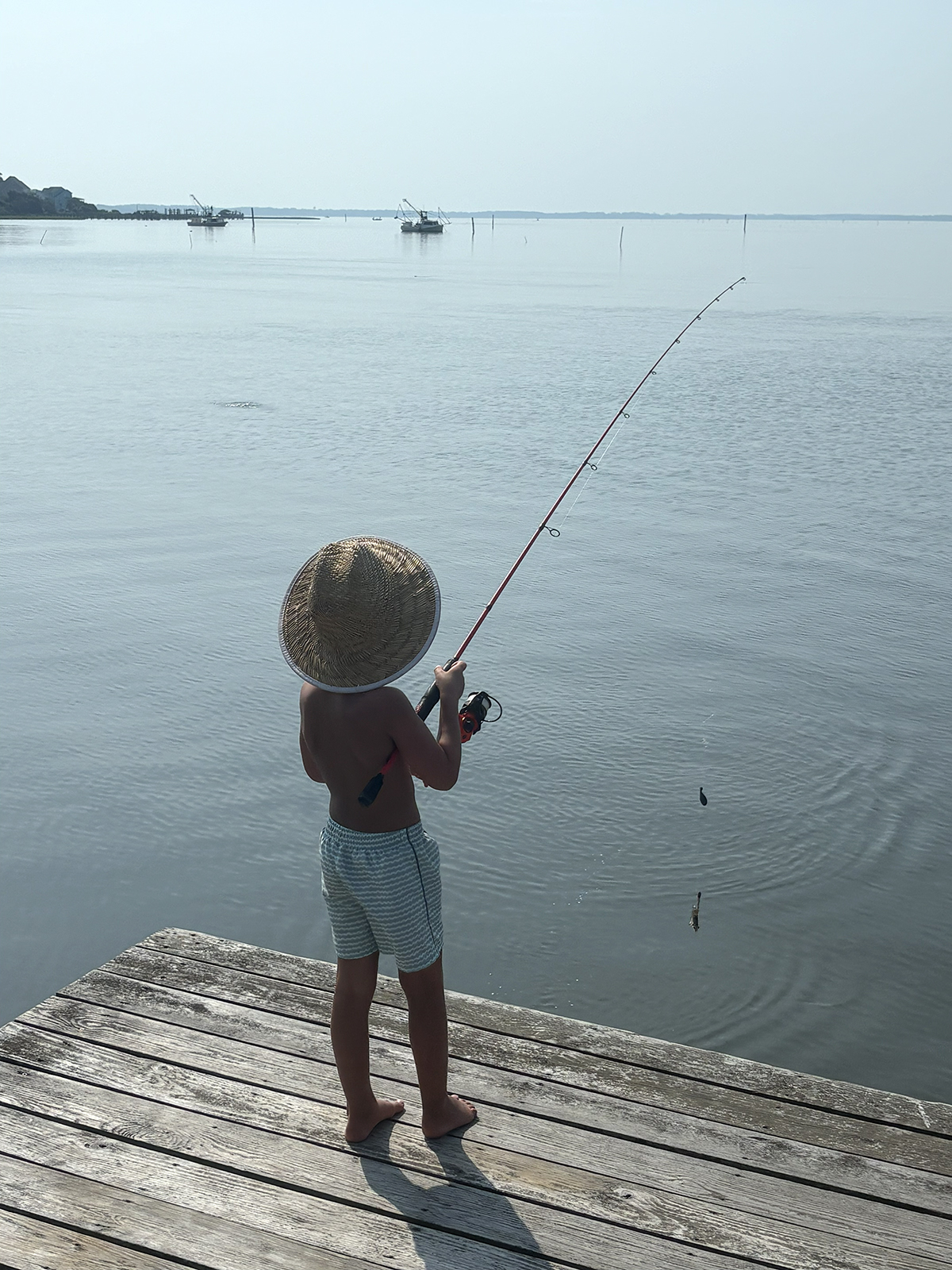Case Skinner, 4, son of Kathleen and Jeremy Skinner, fishes from his parents' dock on on the Newport River in Mill Creek, an unincorporated community in central Carteret County. The young Skinner is also accomplished with a cast net. Photo: Jeremy Skinner