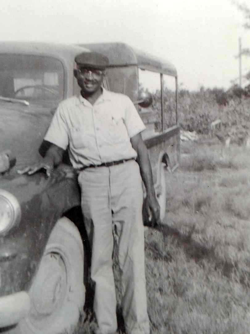 Young Sonny Nixon poses by the kind of truck he would have used to peddle oysters, seafood and other produce across the Cape Fear region. Photo courtesy of the Nixon family.