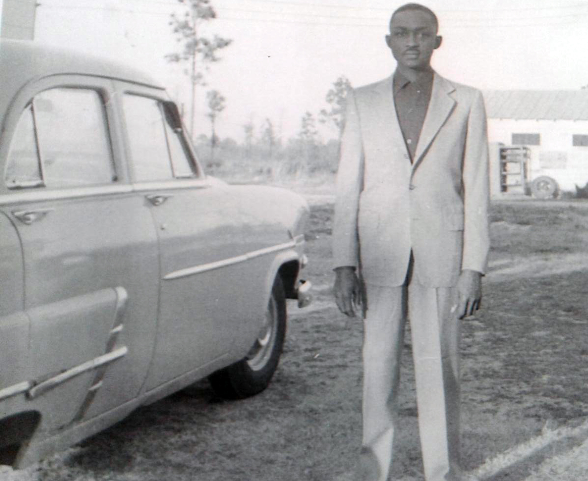 Young Sonny Nixon is nattily dressed beside a 1950s Ford. Nixon’s daughter, Alice Nixon, was surprised to discover this old photo of her father. “I've never seen him that way because it was, it was just, you know, I’m used to him being serious in business.” Photo courtesy of the Nixon family.