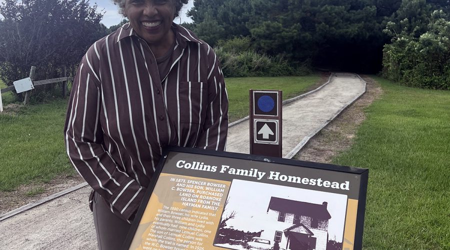 Joan Collins poses at the Marshall and Gussie Collins Walkway on Roanoke Island.