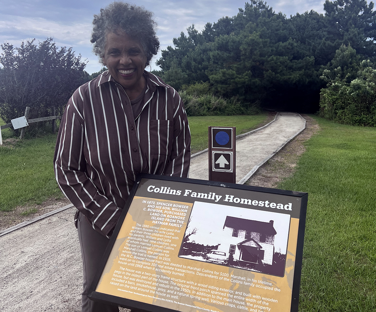 Joan Collins poses at the Marshall and Gussie Collins Walkway on Roanoke Island.