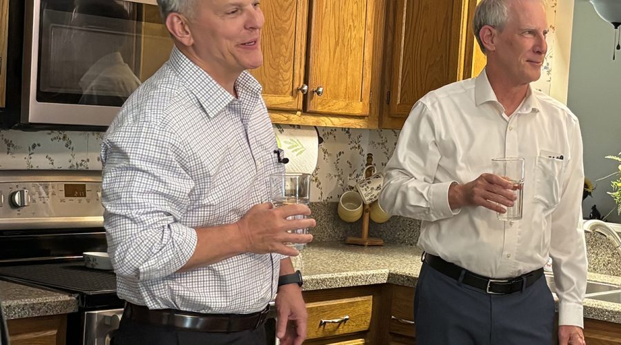 North Carolina Gov. Josh Stein, left, and Department of Environmental Quality Secretary Reid Wilson taste water Brenda Moore served from the kitchen tap in her Wilmington-area home on Wednesday. Photo: Trista Talton