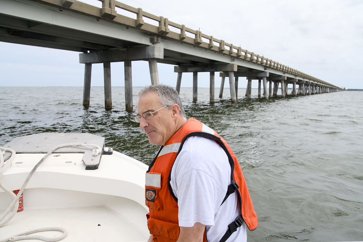 North Carolina Department of Transportation Resident Engineer Pablo Hernandez takes Coastal Review under the bridge. Photo: Kip Tabb