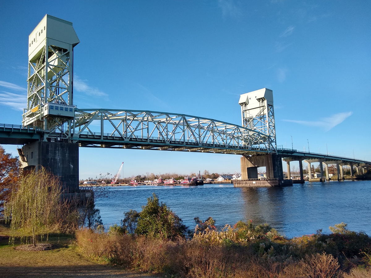 The Cape Fear Memorial Bridge, shown here as viewed from Dram Tree Park, was completed in 1969 and now the four-lane, vertical-lift bridge can no longer effectively service current traffic demands, officials say. Photo: PlaneManRockFan/Creative Commons