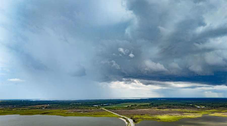 Humidity fills the air west of the Jonathan Robinson Bridge, creating a series of summer squalls shower eastern Carteret County. Photo: Dylan Ray