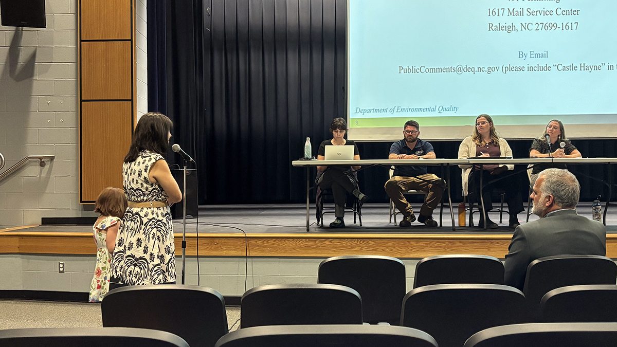 New Hanover County resident Margie Gewirtzman, accompanied by her daughter, speaks Tuesday night during public hearing regarding Martin Marietta's proposal to expand its Castle Hayne quarry. Photo: Trista Talton