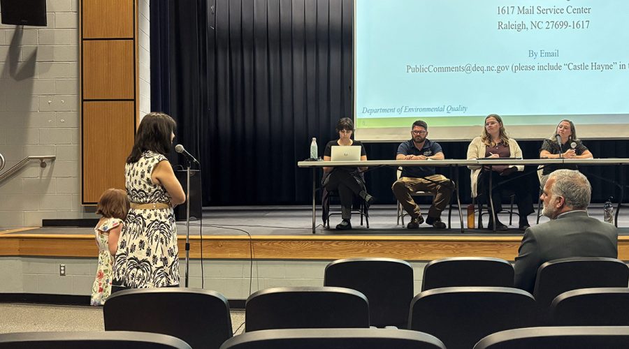New Hanover County resident Margie Gewirtzman, accompanied by her daughter, speaks Tuesday night during public hearing regarding Martin Marietta's proposal to expand its Castle Hayne quarry. Photo: Trista Talton