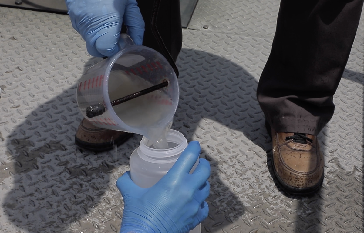 A sample is collected at a wastewater treatment plan. Photo: UNC-IMS