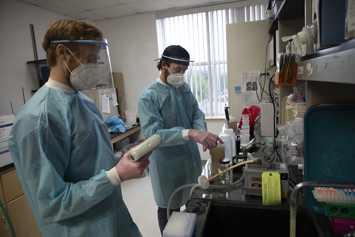 Dr. Mark Ciesielski, left and shown here while still a doctoral student, and Tom Clerkin, a research technician in the University of North Carolina Noble Lab. Photo: Maggie May/UNC Research 