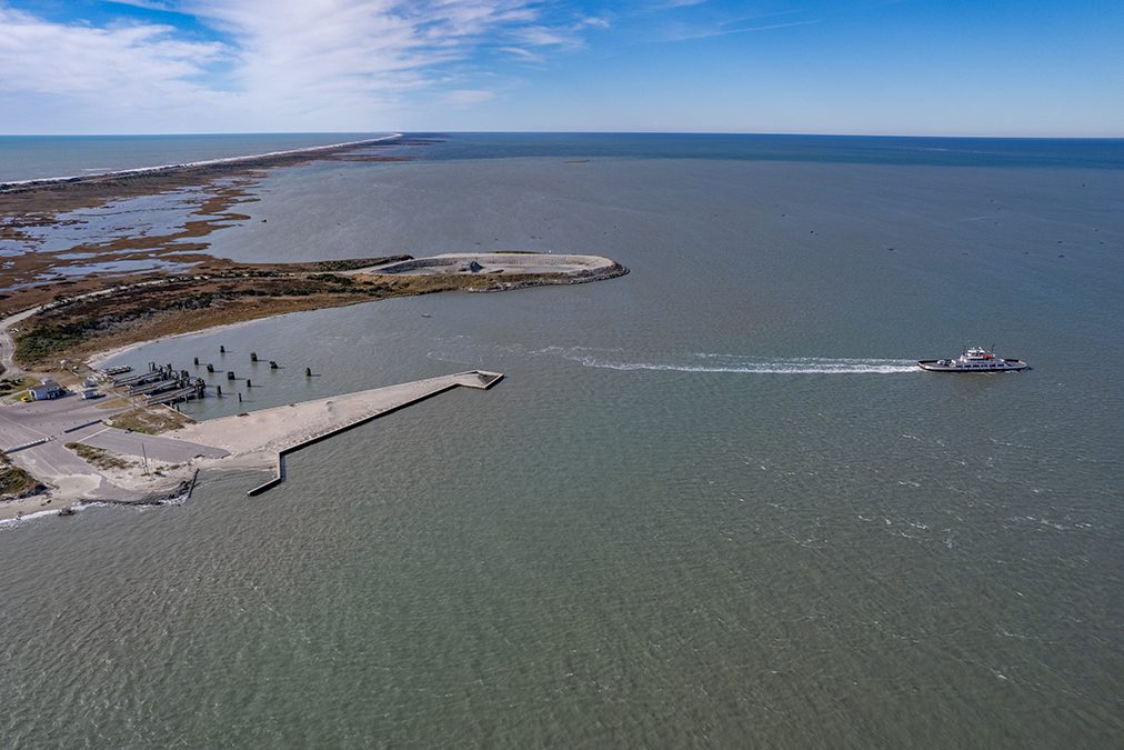 An N.C. Department of Transportation ferry leaves the terminal recently at the north end of Ocracoke Island in Hyde County, where it will cross Hatteras Inlet for Hatteras Island in Dare County. The route is traveled several times a day currently at no cost to passengers. Photo Illustration: Dylan Ray