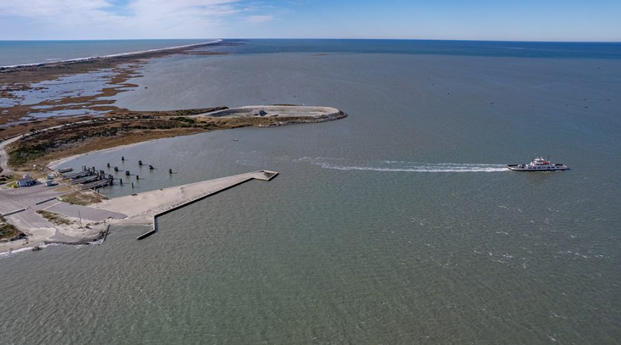 An N.C. Department of Transportation ferry leaves the terminal recently at the north end of Ocracoke Island in Hyde County, where it will cross Hatteras Inlet for Hatteras Island in Dare County. The route is traveled several times a day currently at no cost to passengers. Photo Illustration: Dylan Ray