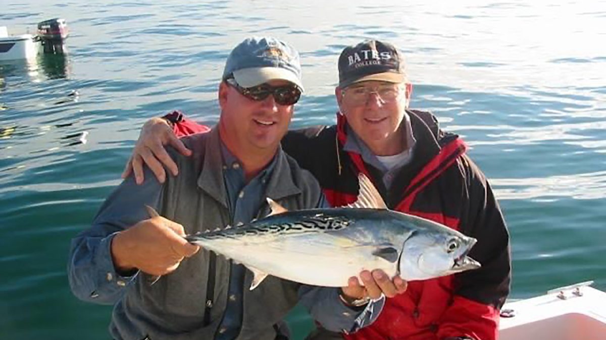 Capt. Gordon shows off a Cape Lookout false albacore caught by his Pops.