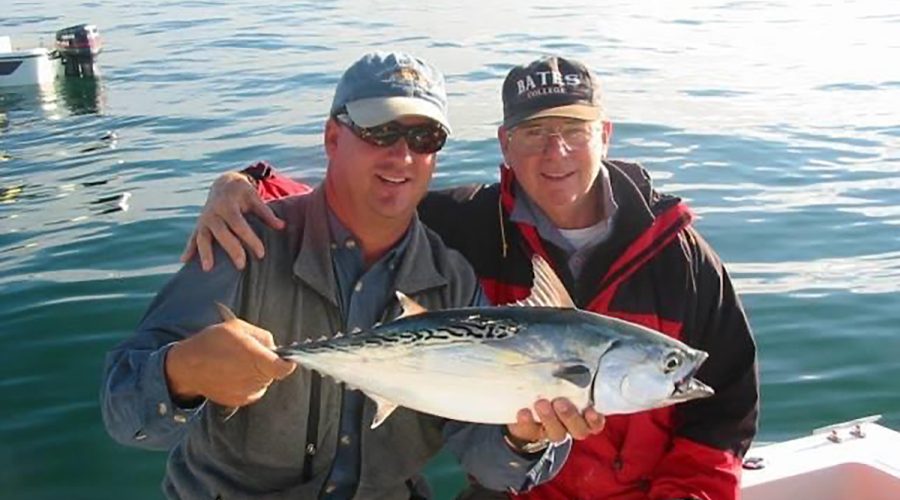 Capt. Gordon shows off a Cape Lookout false albacore caught by his Pops.