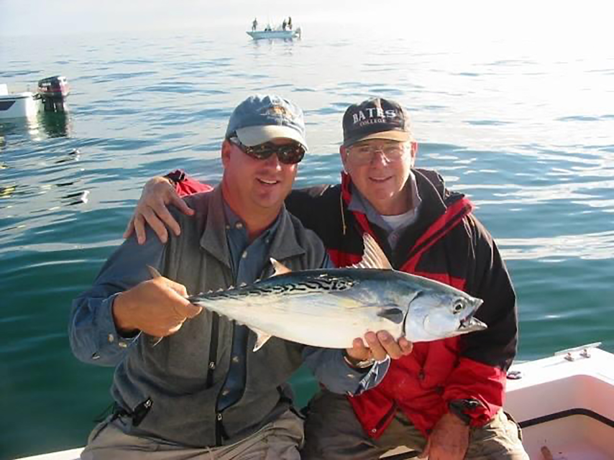 Capt. Gordon shows off a Cape Lookout false albacore caught by his Pops.