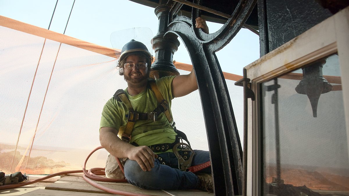 Tyler Mosca with ICC Commonwealth of New York prepares to begin his restoration work at the top of the tower. Photo: Kip Tabb