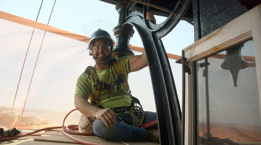 Tyler Mosca with ICC Commonwealth of New York prepares to begin his restoration work at the top of the tower. Photo: Kip Tabb