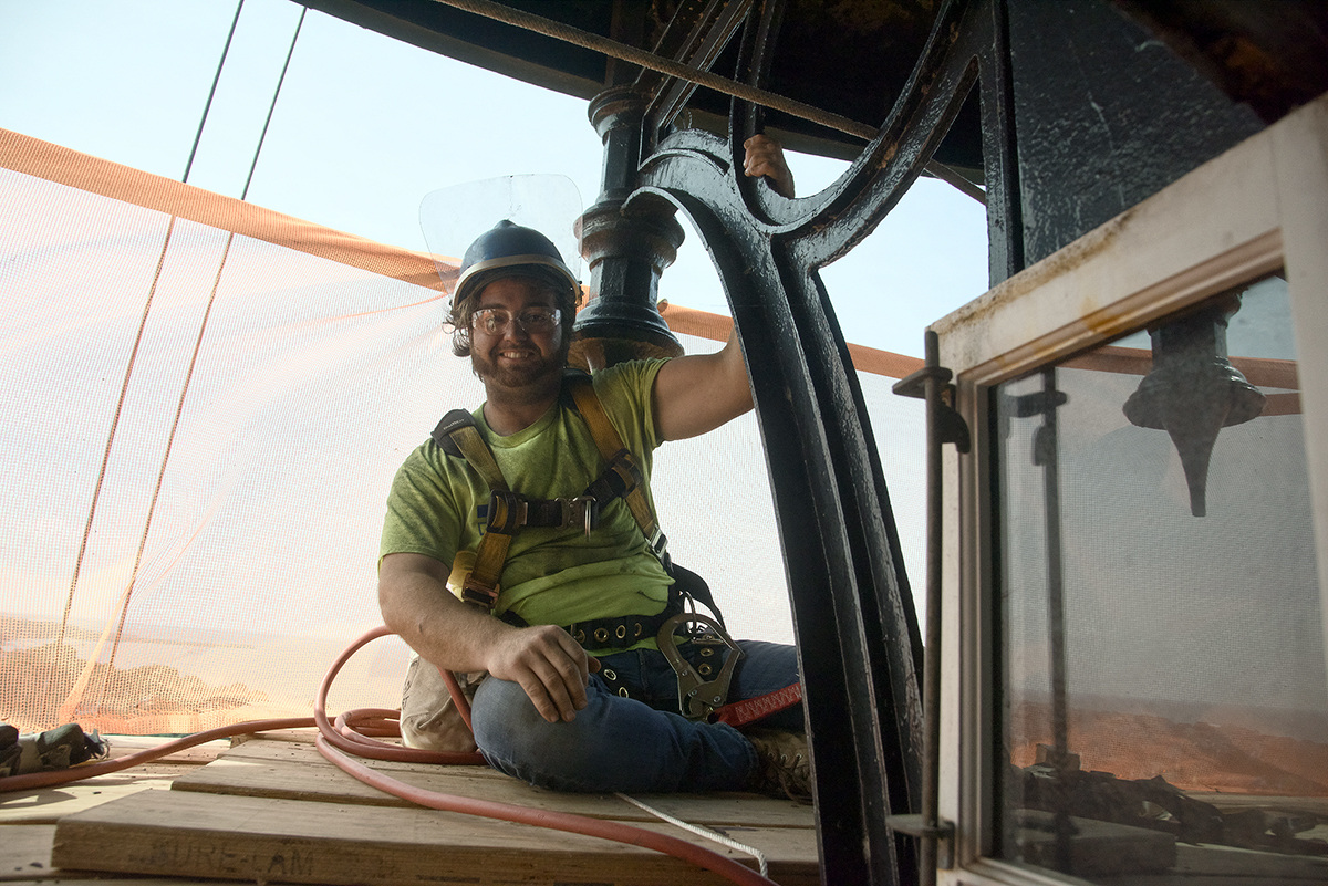 Tyler Mosca with ICC Commonwealth of New York prepares to begin his restoration work at the top of the tower. Photo: Kip Tabb