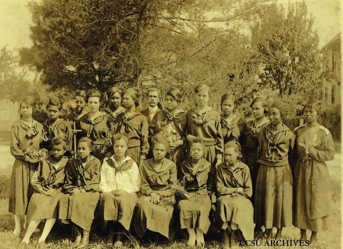 This is Principal Peter W. Moore and a group of teachers from Bertie County, N.C., at the State Normal School for a summer school session in 1916. African American teachers often studied at the school during their summer breaks to gain full teacher certification. Photo courtesy, University Archives, Elizabeth City State University