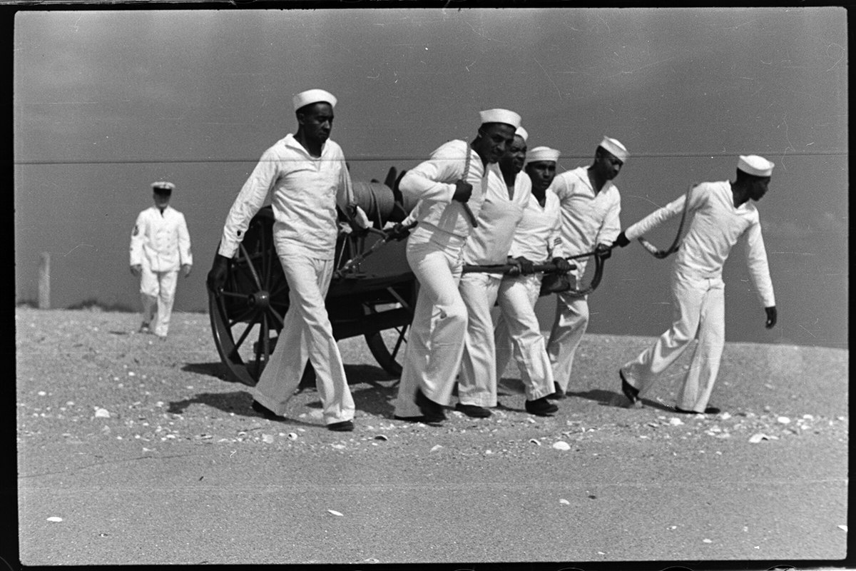 The Pea Island Station crew moves equipment across the beach in this newly discovered 1938 image from the SR.44.47 Conservation and Development Travel Information Photograph Collection, State Archives of North Carolina.