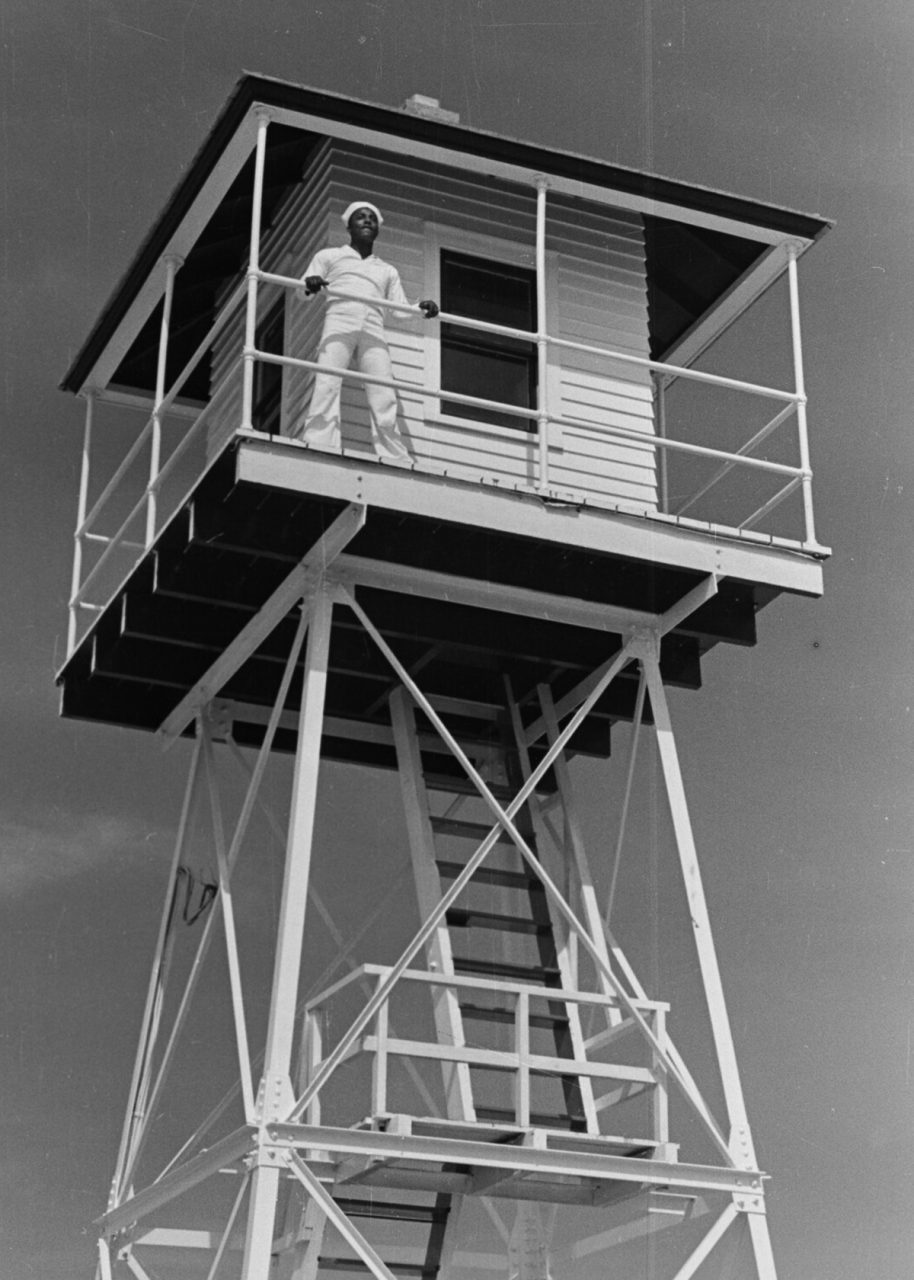 A Coast Guardsman with the Pea Island Station crew mans an observation tower in this newly discovered 1938 image from the SR.44.47 Conservation and Development Travel Information Photograph Collection, State Archives of North Carolina.