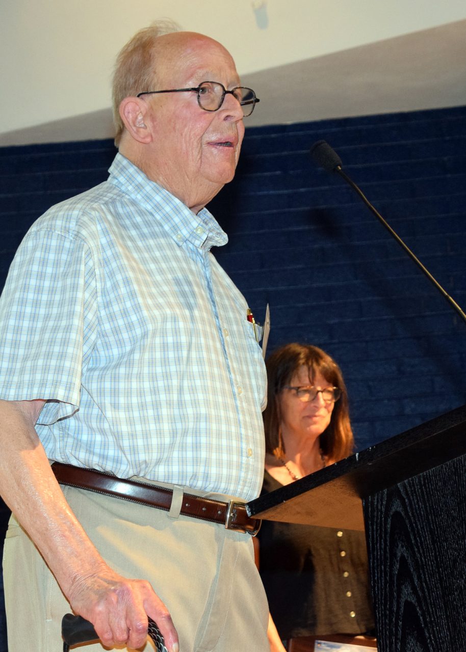 Historian Glenn Blackburn, professor emeritus of history at University of Virginia’s College at Wise, accepts his Lifetime Achievement Award “For Excellence in Coastal History and Conservation Writing” from North Carolina Coastal Federation Board Liaison and Special Projects Manager Lauren Kolodij Saturday in Morehead City,. Photo: Mark Hibbs