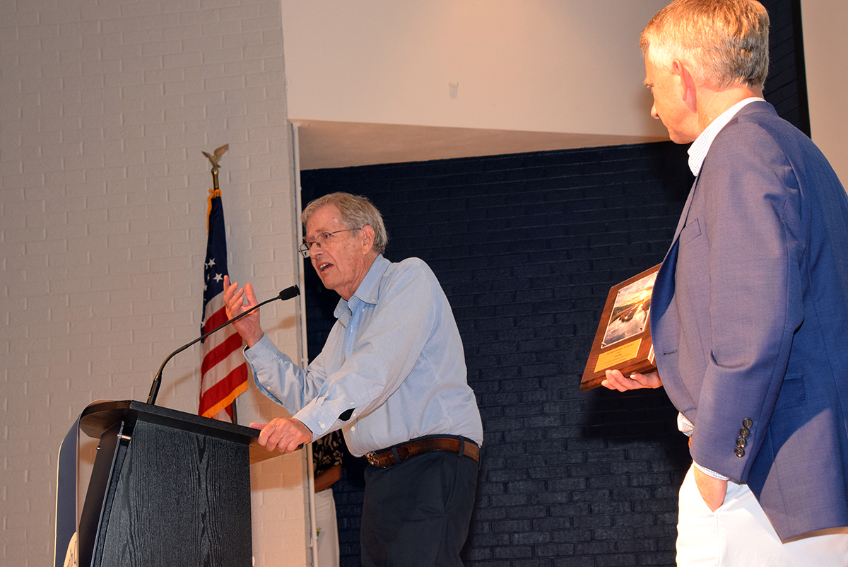 Dr. Stan Riggs, left, accepts his Pelican Award “For Distinguished Leadership and Lifetime Excellence in Coastal Research, Science, and Stewardship” from North Carolina Coastal Federation Executive Director Braxton Davis Saturday in Morehead City. Photo: Mark Hibbs