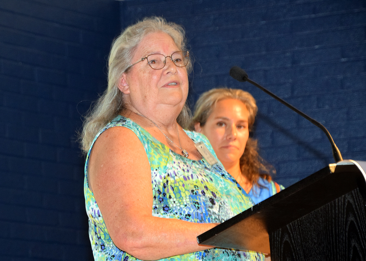 Retired educator Jayne Young accepts her award for For Outstanding Volunteer Service Advancing Coastal Environmental Education" as Coastal Advocate Dr. Lela Schlenker stands in the background. Photo: Mark Hibbs