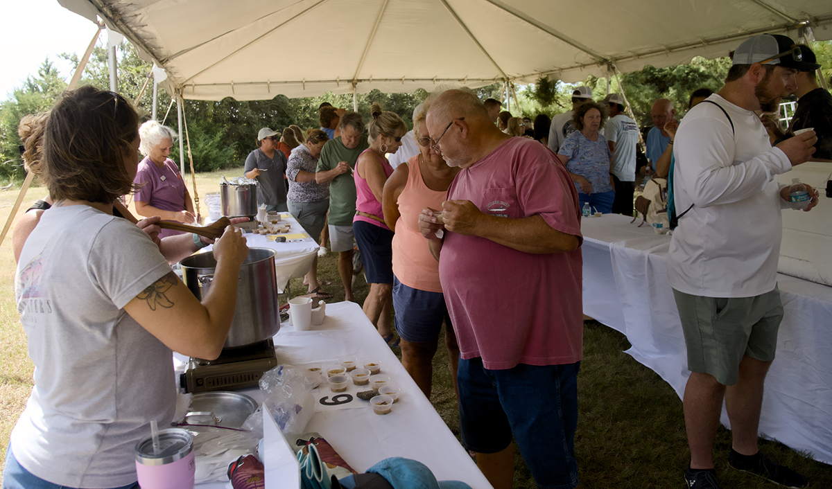 Participants line up for tastings during the chowder cookoff Saturday at the Day at the Docks, which raised more than $3,000 for the Hatteras Island Cancer Foundation. Photo: Kip Tabb