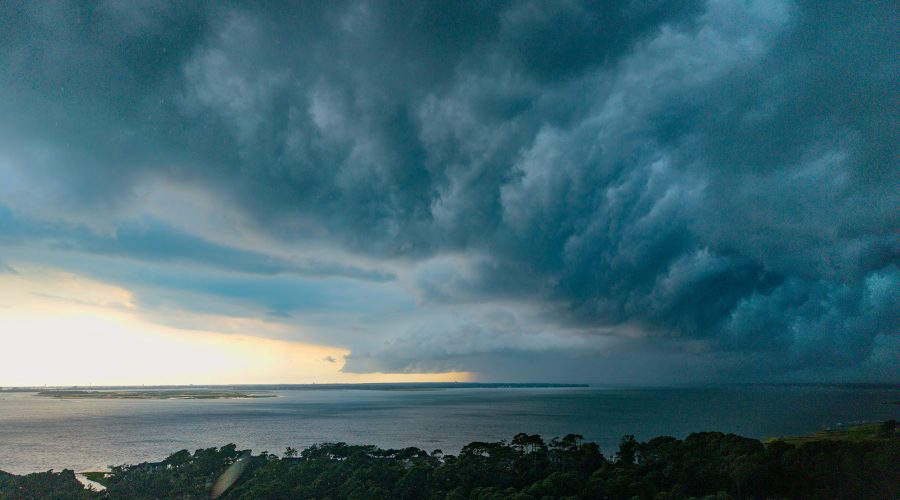A squall line moves quickly across the Newport River toward Bogue Banks and Onslow Bay Saturday in Carteret County. Temperatures Sunday and Monday were cooler, in the mid- to upper-80s, but highs in the 90s are forecast to return later this week. Photo: Dylan Ray