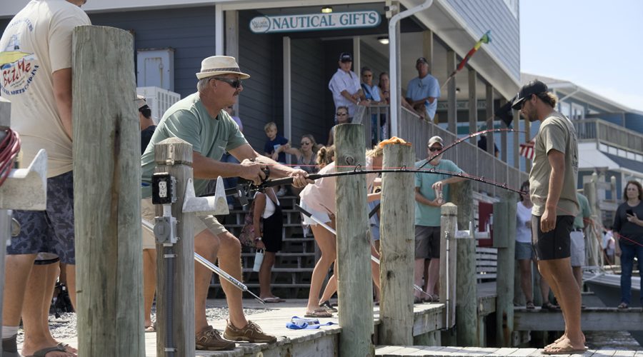 Participants compete in reeling in a big one during the Concrete Marlin and Sailfish competitions at the 22nd annual Day at the Docks Saturday in Hatteras Village. It’s harder than it looks. Photo: Kip Tabb