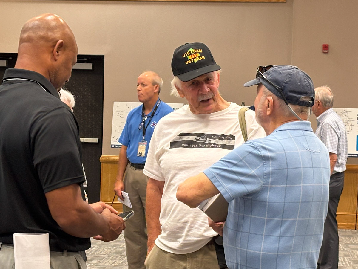 Larry Summers, of Oriental, chats with others attending the N.C. Ferry Division's first in a series of listening sessions on Tuesday night in Beaufort County. Photo: Trista Talton